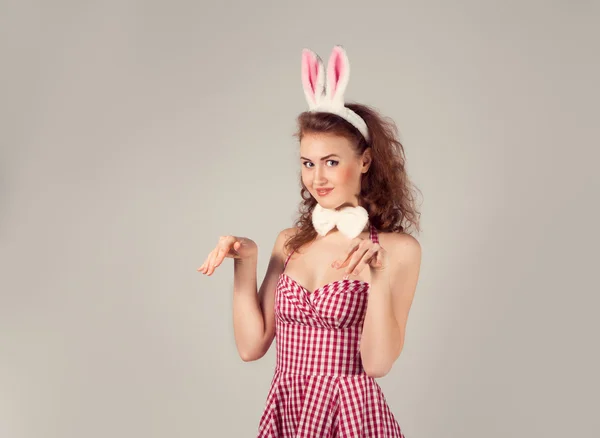 Sexy girl wearing easter bunny costume with eggs in basket — Stock Photo, Image