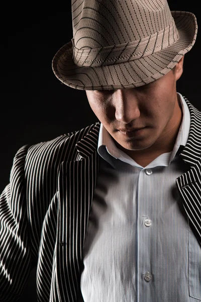 The man in style Chicago gangster on dark background — Stock Photo, Image