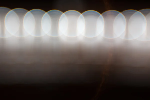 Siyah arkaplandaki bokeh ışıklarının fotoğrafı — Stok fotoğraf