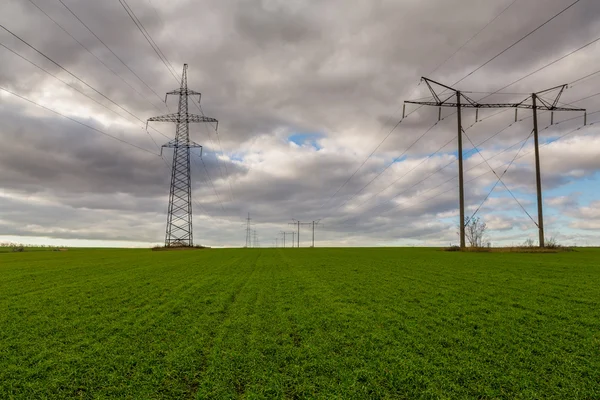 Power pylons in a field on a foggy morning in the Netherlands — Stock Photo, Image