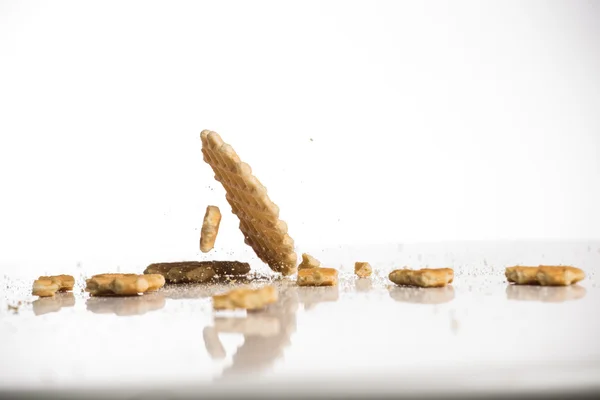 Falling cookies on white background — Stock Photo, Image