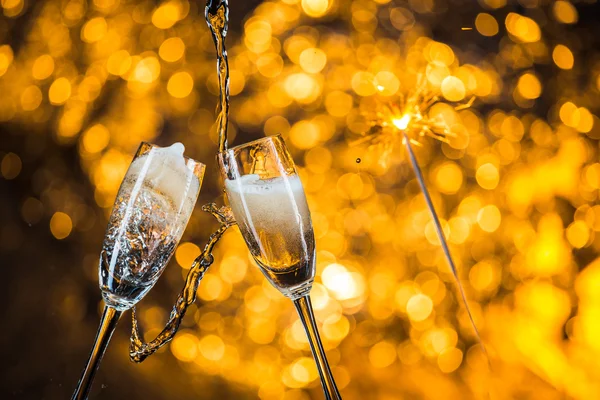 New Year's at midnight with champagne glasses on light background — Stock Photo, Image