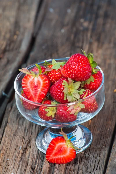 Isolated strawberry isolated on rustic wooden background — Stock Photo, Image