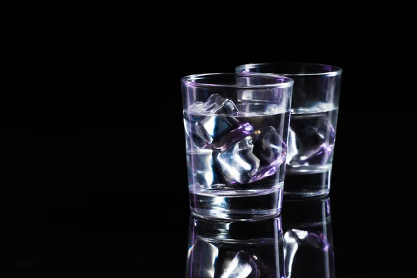 Two glasses of vodka with ice cubes — Stock Photo, Image
