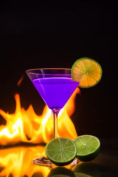 Burning alcoholic drink with ice cubes, isolated on black background — Stock Photo, Image