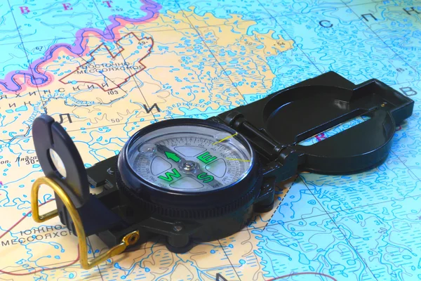 A compass and a map of the North of Russia — Stock Photo, Image