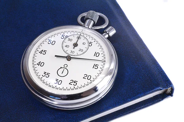 Stopwatch and the notebook on a white background — Stock Photo, Image