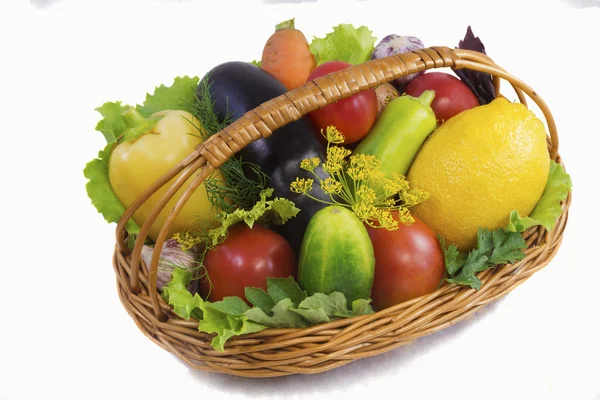 Basket with fruits and vegetables , photographed on a white back — Stock Photo, Image