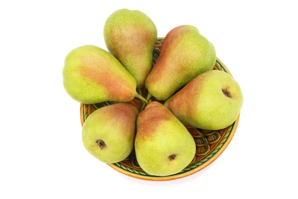 Ripe pears on the plate on a white background. — Stock Photo, Image