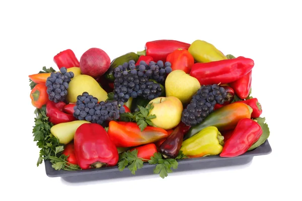 Fruits , pepper and parsley leaves on a plate on a white backgro — Stock Photo, Image