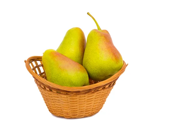 Large ripe pears in a wicker basket on a white background. — Stock Photo, Image