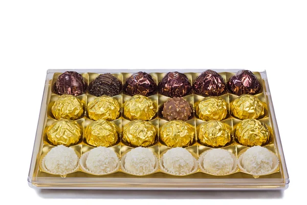 Chocolate sweets in the box on the white background. — Stock Photo, Image