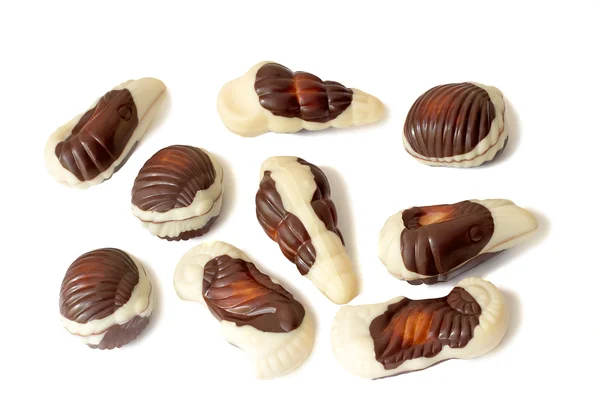 Chocolates of a various form on a white background. — Stock Photo, Image