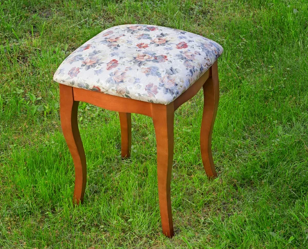 Convenient stool with the seat upholstered with a gobelin. — Stock Photo, Image