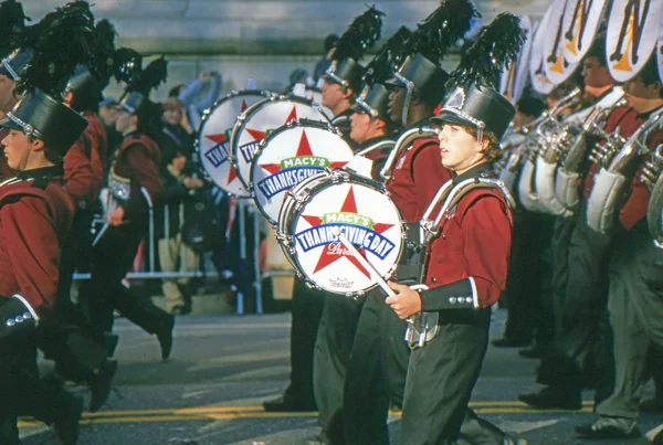 NEW YORK-NOV 22: A holiday tradition since 1924, the annual Macy's Thanksgiving Day Parade is seen by more than 3.5 million people. Seen in 2012 is the drum section of one of the many marching bands. — Stock Image NEW YORK-NOV 22: A holiday tradition since 1924, the annual Macy's Thanksgiving Day Parade is seen by more than 3.5 million people. Seen in 2012 is the drum section of one of the many marching bands. Stock Picture