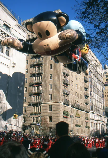 NEW YORK-NOV 22: A holiday tradition since 1924, the annual Macy's Thanksgiving Day Parade is seen by more than 3.5 million people. Pictured here in 2012 is the Julius the Monkey balloon. — Stock Image NEW YORK-NOV 22: A holiday tradition since 1924, the annual Macy's Thanksgiving Day Parade is seen by more than 3.5 million people. Pictured here in 2012 is the Julius the Monkey balloon. Royalty Free Stock Images