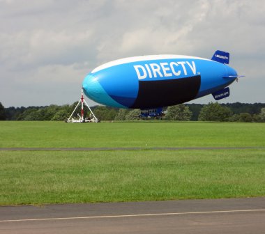 SOLBERG AIRPORT-READINGTON, NEW JERSEY, USA-SEPT 06: Seen attached to the mooring mast in 2012 is the DIRECTV blimp. clipart