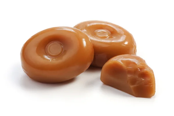 Caramel candies on white — Stock Photo, Image