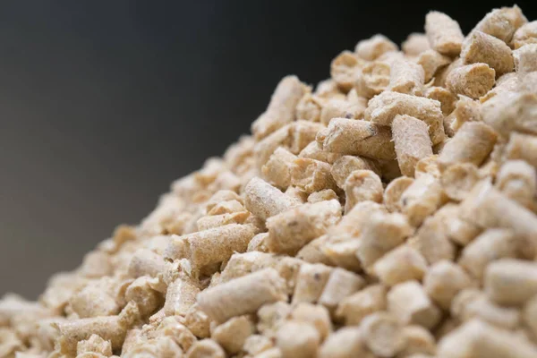 Pine sawdust Heating pellets stacked in the tank. Close up.