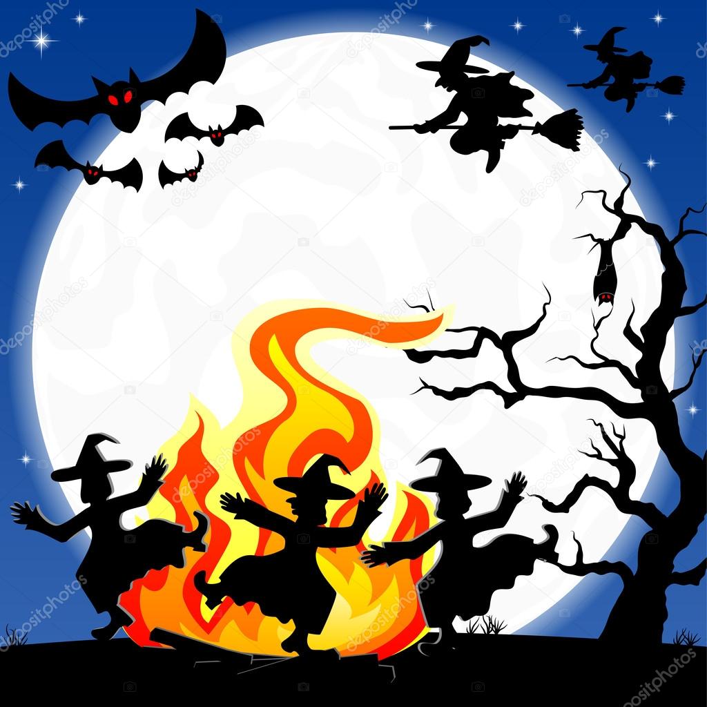 witches dancing around fire at halloween