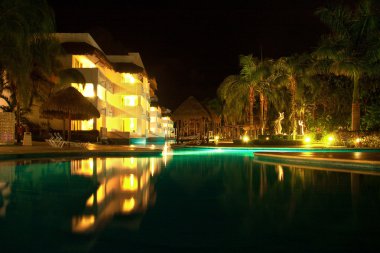 Playa del Carmen illuminated pool at night clipart