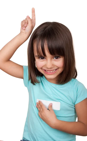 Little girl lifting a finger smiling — Stock Photo, Image