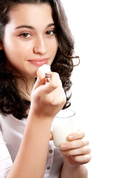 Beautiful woman eating yogurt — Stock Photo, Image