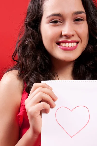 Mooi meisje met een hart tekening — Stockfoto
