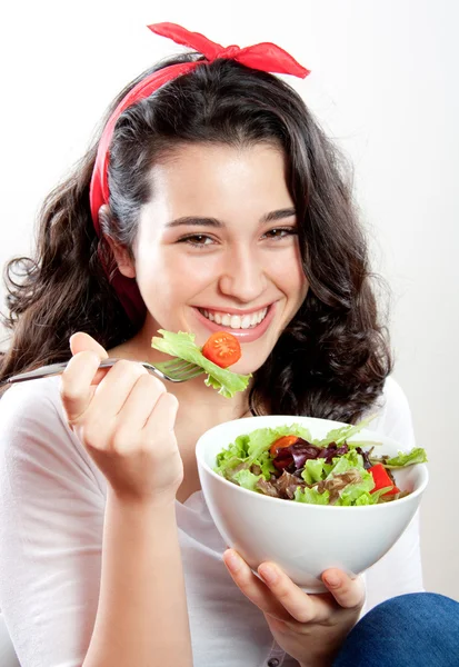 Happy girl eating salad — Stock Photo, Image