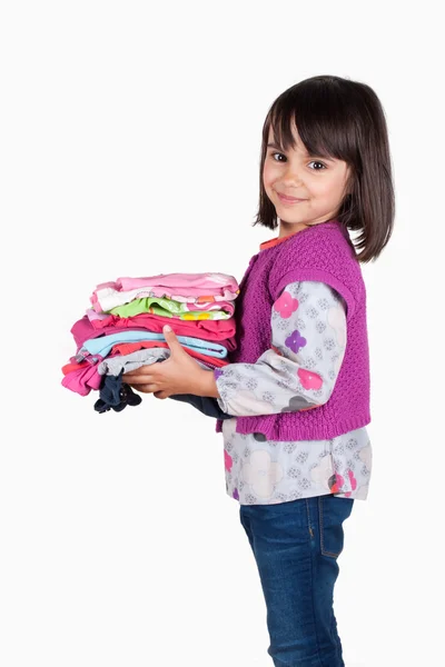 Niño feliz con una pila de camisas —  Fotos de Stock