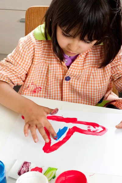 Little girl painting with fingers — Stock Photo, Image