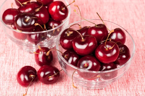 Closeup of two glass bowl full of cherries — Stock Photo, Image