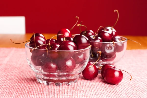 Bowls of cherries on the table — Stock Photo, Image