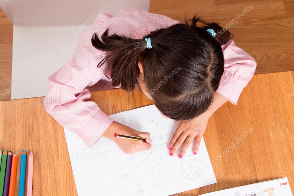 Girl learning to write