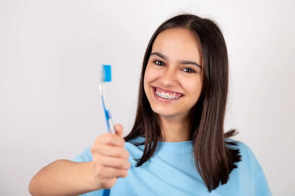 Portrait Happy Teen Girl Braces Holding Toothbrush Smiling Isolated White — Stock fotografie