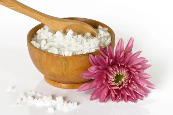 Sea salt in a wooden bowl with flower — Stock Photo, Image