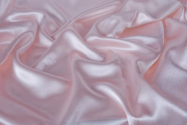 Розовый атласный фон — стоковое фото