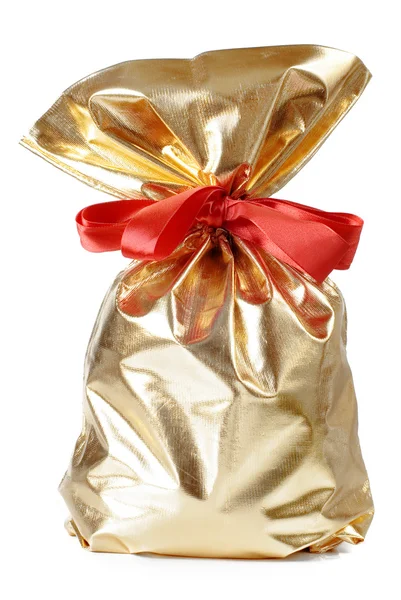 Gyllene gåva väska med en röd rosett — Stockfoto