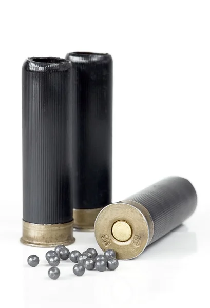 Three hunting cartridge and lead shot — Stock Photo, Image