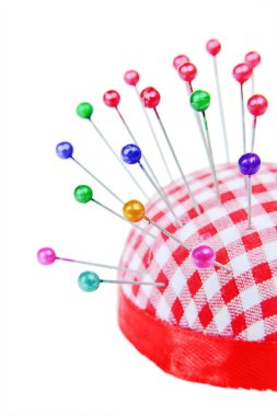 Pins stuck into the pincushion clipart