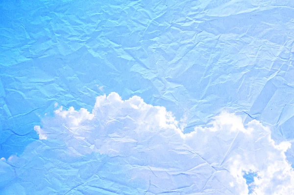 Blue sky on crumpled paper — Stock Photo, Image