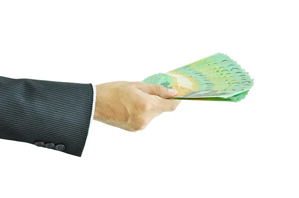 Hand som håller pengar - australiska dollar — Stockfoto