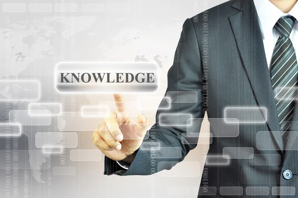 Businessman touching KNOWLEDGE sign — Stock Photo, Image