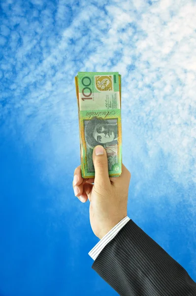 Hand holding up money - Australian dollars — Stock Photo, Image