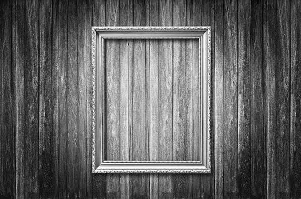 Old style picture frame on wooden wall — Stock Photo, Image