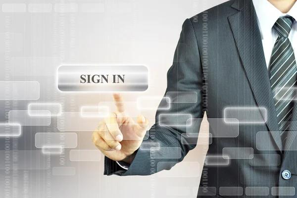 Businessman touching SiGN IN button — Stock Photo, Image