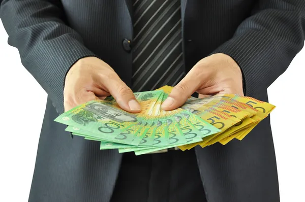 Üzletember kezében tartja a pénzt - Ausztrál dollár — Stock Fotó