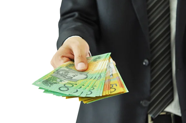 Podnikatel dává peníze - Australské dolary — Stock fotografie