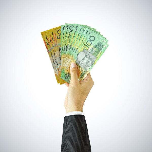 Hand giving money - AUD - Australian Dollars