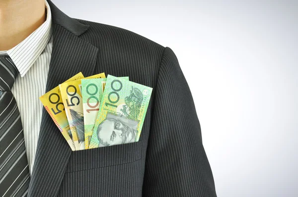 Geld in zakenman zak passen - aud - Australische dollars — Stockfoto